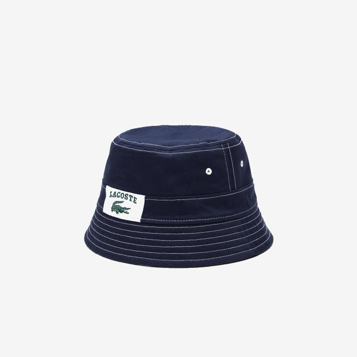 hombres Lacoste 6F242342 azul marino blanco 525 sombrero de pescador heritage de algodón liso o estampado reversible
