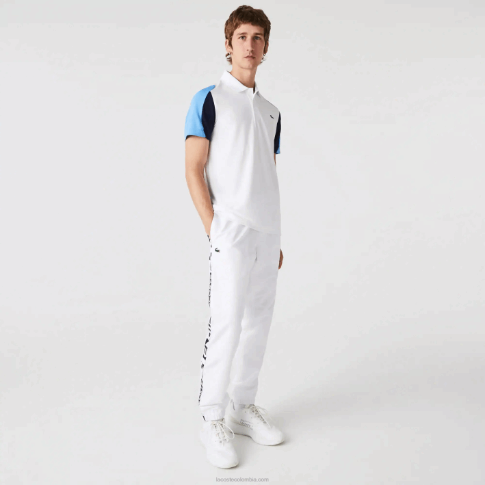 hombres Lacoste 6F24556 blanco azul marino 5yp Polo deportivo de tenis de piqué resistente a las carreras de ajuste regular