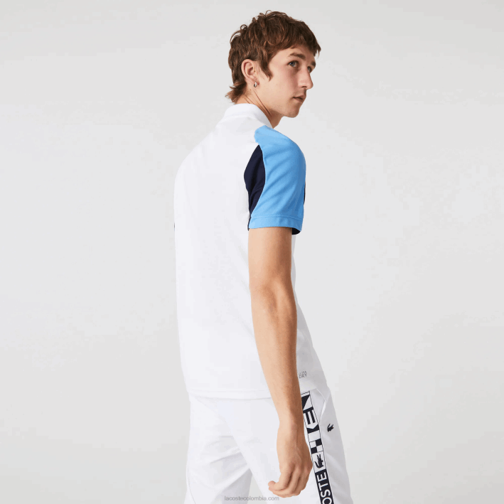 hombres Lacoste 6F24556 blanco azul marino 5yp Polo deportivo de tenis de piqué resistente a las carreras de ajuste regular