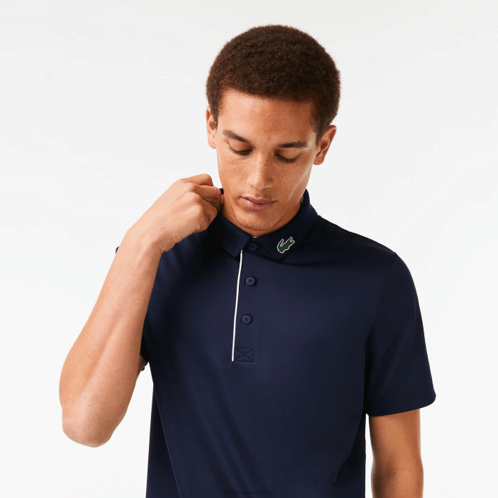 hombres Lacoste 6F24596 azul marino blanco 525 polo de golf de punto deportivo
