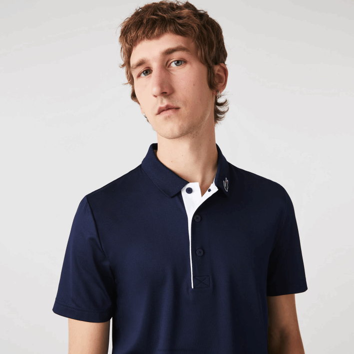hombres Lacoste 6F24596 azul marino blanco 525 polo de golf de punto deportivo