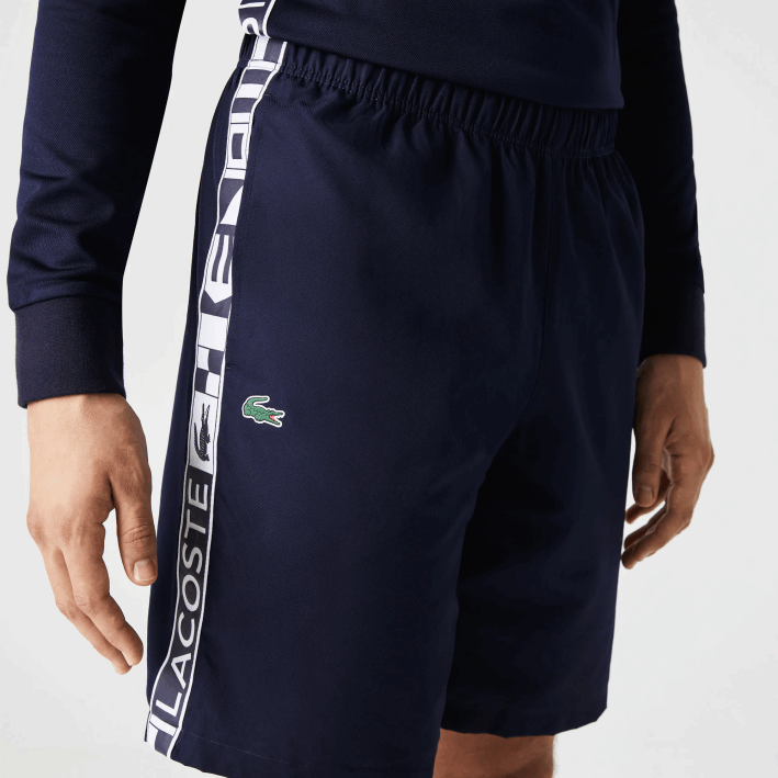 hombres Lacoste 6F241334 azul marino 166 pantalones cortos deportivos de tenis de tafetán
