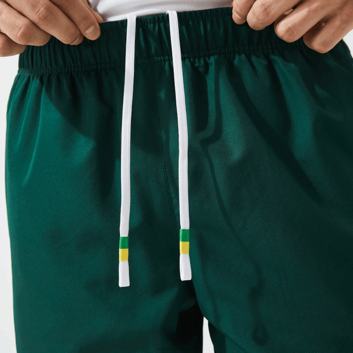 hombres Lacoste 6F241362 verde amarillo blanco 117 shorts deportivos ligeros con bandas en contraste