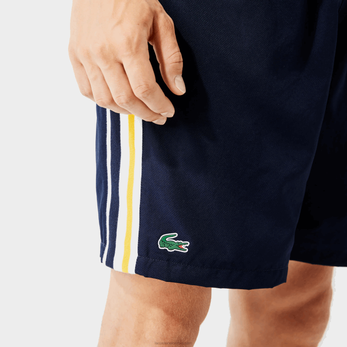 hombres Lacoste 6F241363 azul marino amarillo blanco apk shorts deportivos ligeros con bandas en contraste