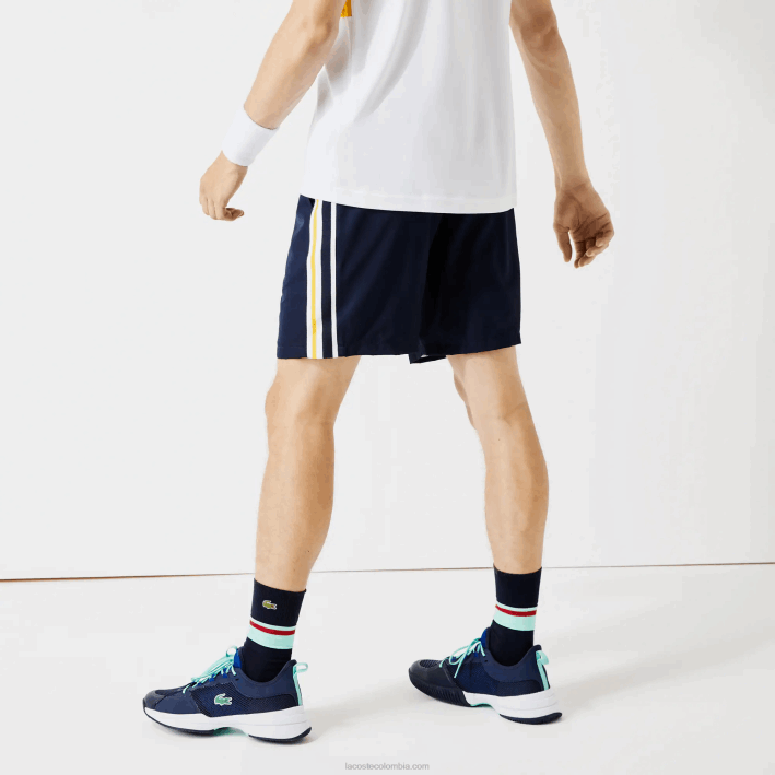 hombres Lacoste 6F241363 azul marino amarillo blanco apk shorts deportivos ligeros con bandas en contraste