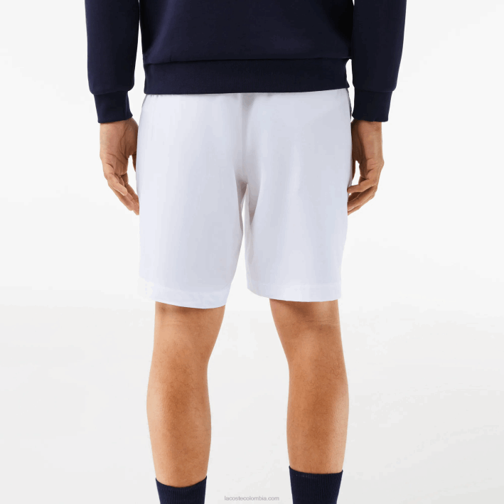 hombres Lacoste 6F241409 blanco azul marino 522 pantalones cortos deportivos ultraligeros