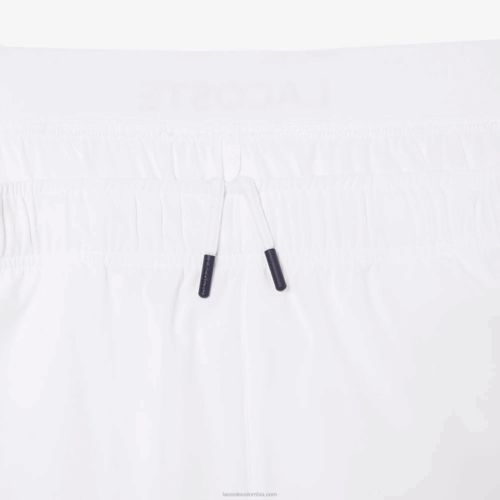 hombres Lacoste 6F241409 blanco azul marino 522 pantalones cortos deportivos ultraligeros
