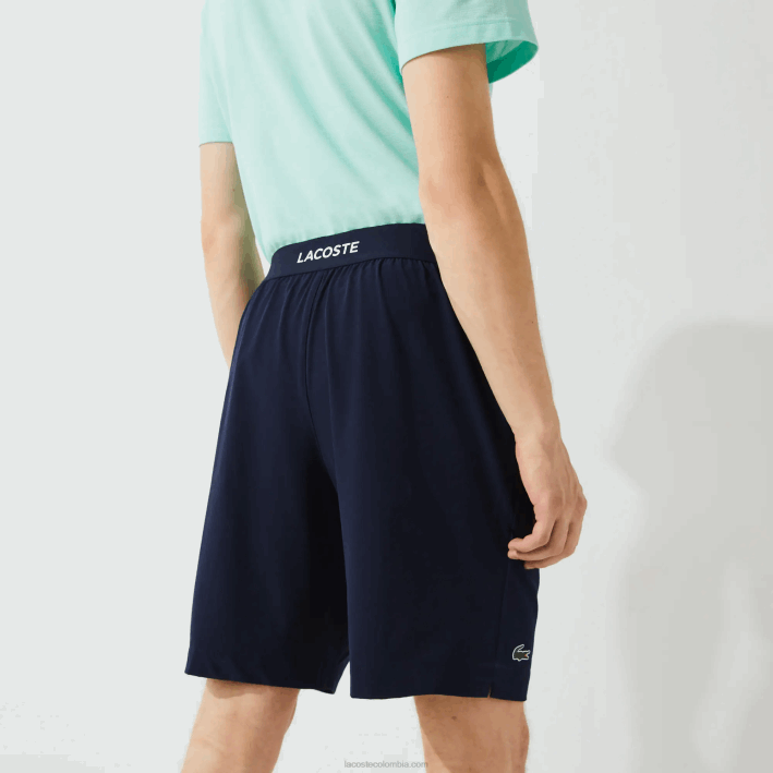 hombres Lacoste 6F241411 azul marino blanco 525 pantalones cortos deportivos ultraligeros