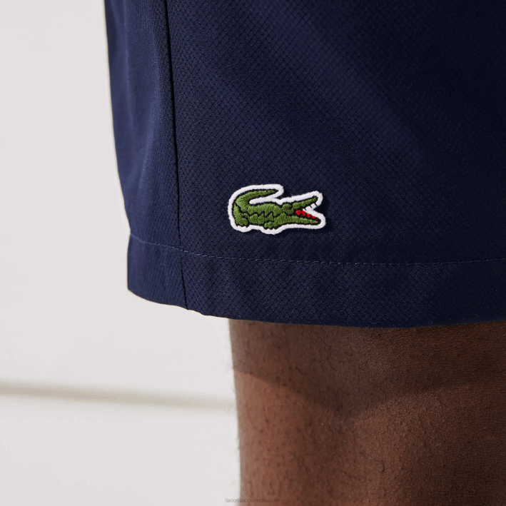 hombres Lacoste 6F241441 azul marino 166 Shorts deportivos de tenis con tejido de diamante sólido