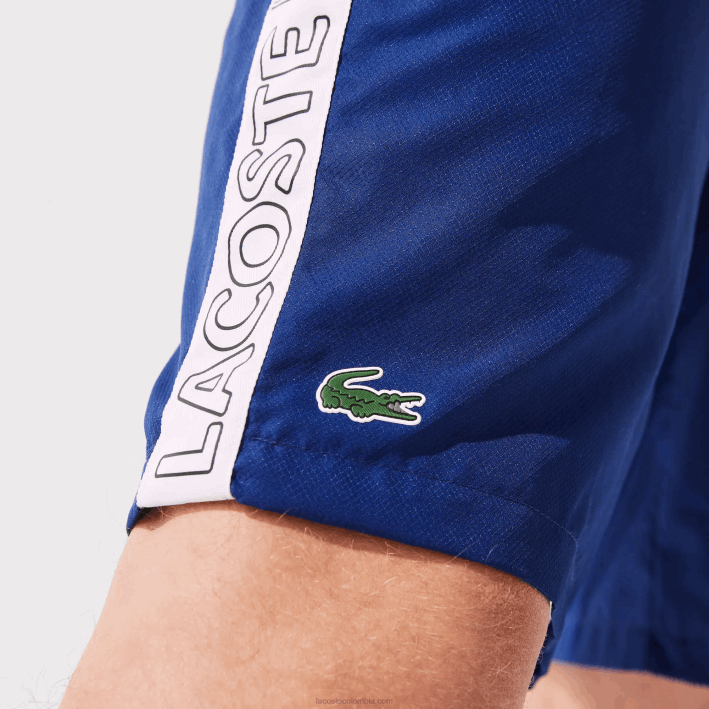 hombres Lacoste 6F241505 azul blanco emj shorts deportivos con franjas laterales
