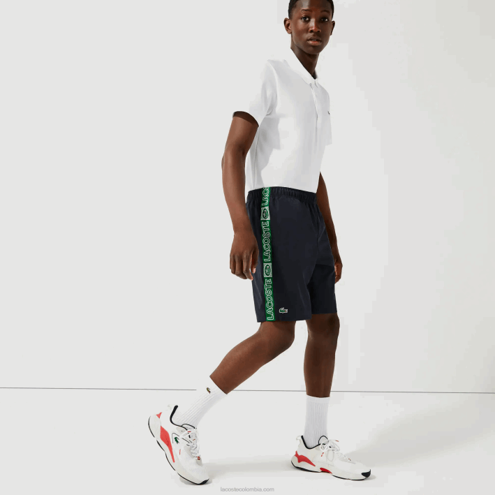 hombres Lacoste 6F241506 azul marino verde mr0 shorts deportivos con franjas laterales