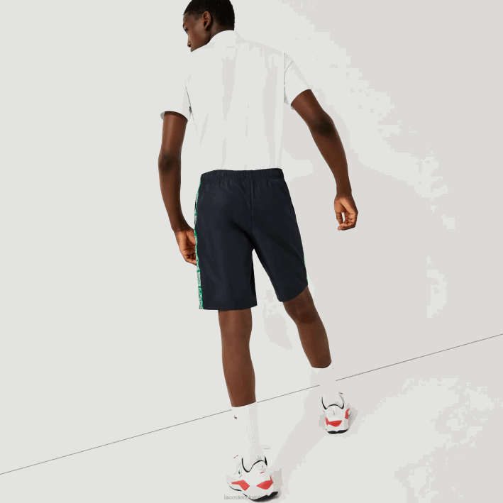hombres Lacoste 6F241506 azul marino verde mr0 shorts deportivos con franjas laterales