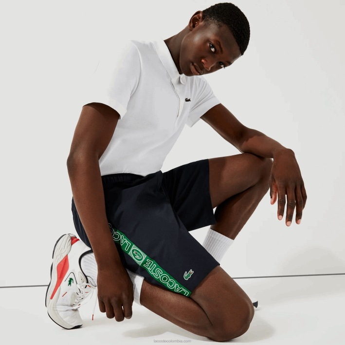hombres Lacoste 6F241506 azul marino verde mr0 shorts deportivos con franjas laterales