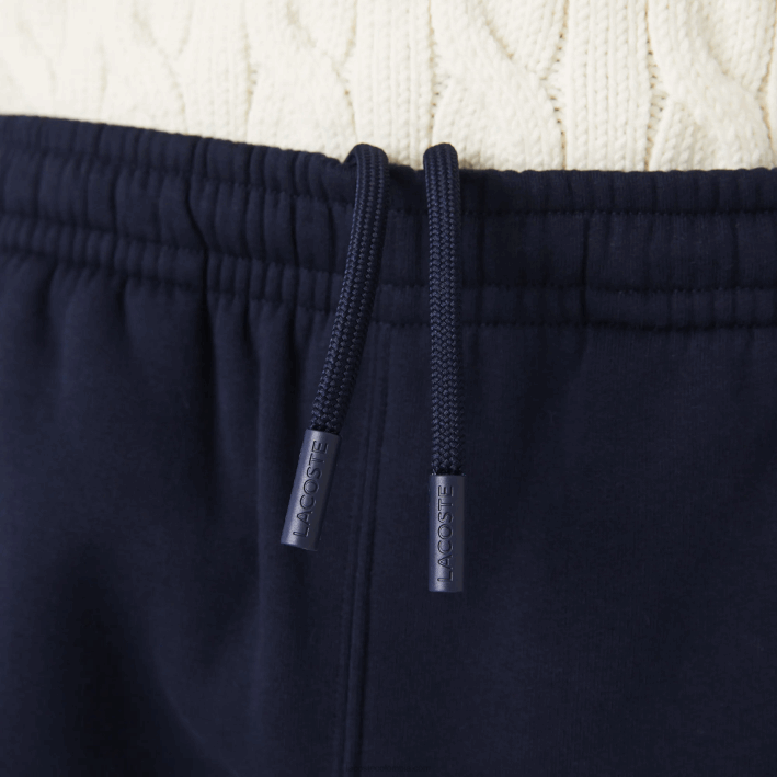 hombres Lacoste 6F241516 azul marino amarillo 144 shorts de felpa cepillada con bloques de color