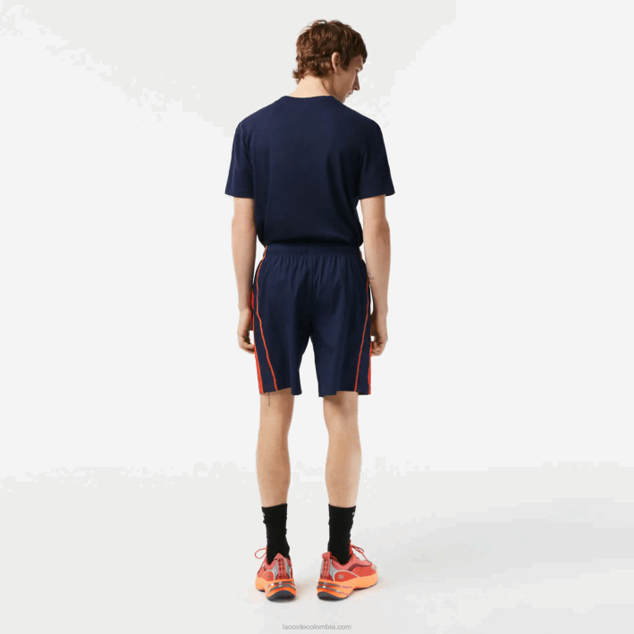 hombres Lacoste 6F24426 azul marino rojo naranja xii pantalones cortos de tenis de poliéster reciclado