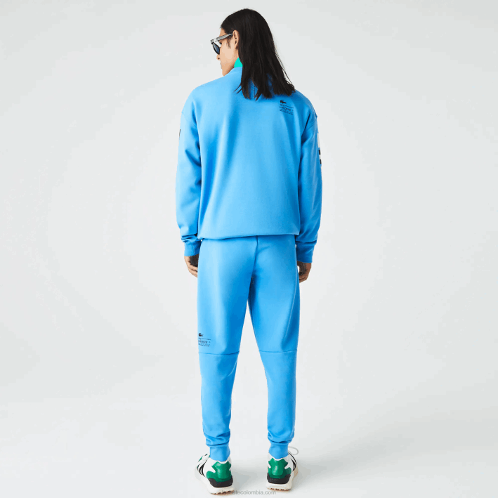 hombres Lacoste 6F241045 azul 4xa pantalones de chándal con estampado reflectante
