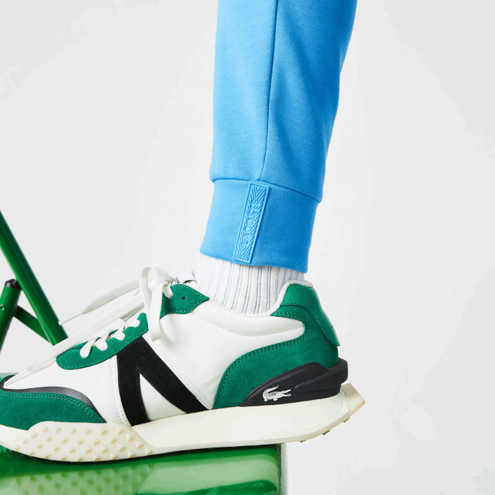 hombres Lacoste 6F241045 azul 4xa pantalones de chándal con estampado reflectante