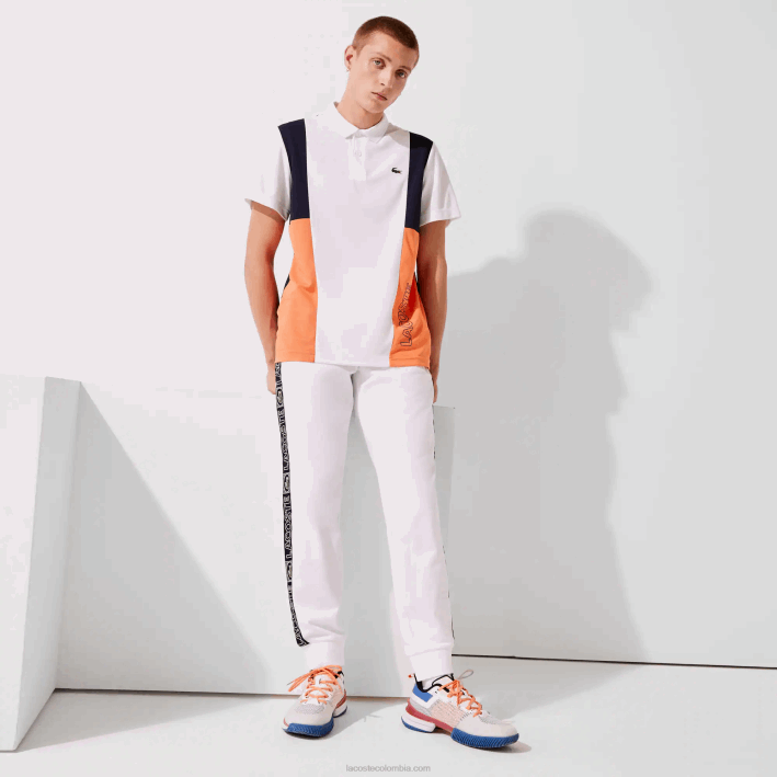 hombres Lacoste 6F241120 blanco naranja azul marino asr pantalones deportivos de chándal con bandas de la marca