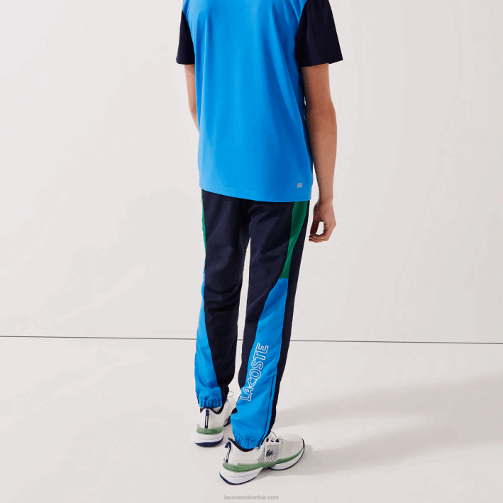 hombres Lacoste 6F241128 verde azul marino blanco m7z pantalones de chándal deportivos con bandas colorblock