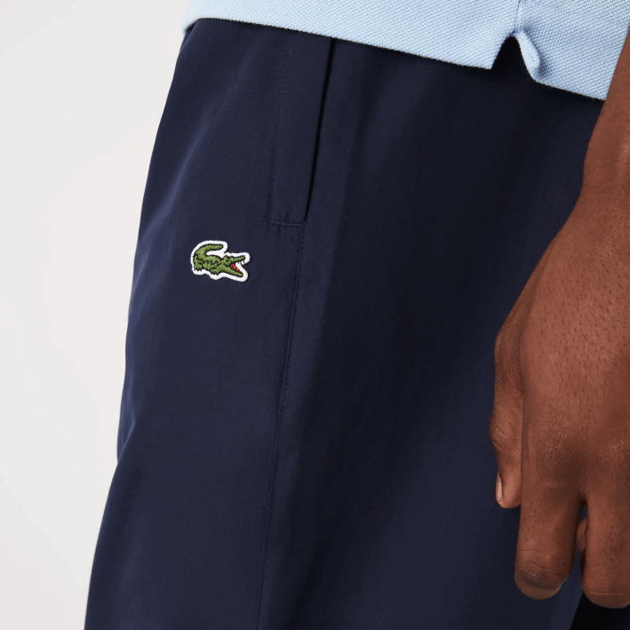 hombres Lacoste 6F24332 azul marino 166 pantalones de chándal repelentes al agua regular fit
