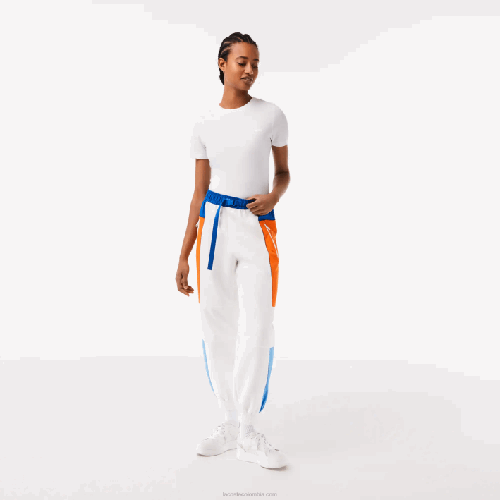 mujer Lacoste 6F242553 blanco azul naranja azul rlm pantalones de chándal con diseño colour block mujer Lacoste 6F242553 blanco azul naranja azul rlm pantalones de chándal con diseño colour block